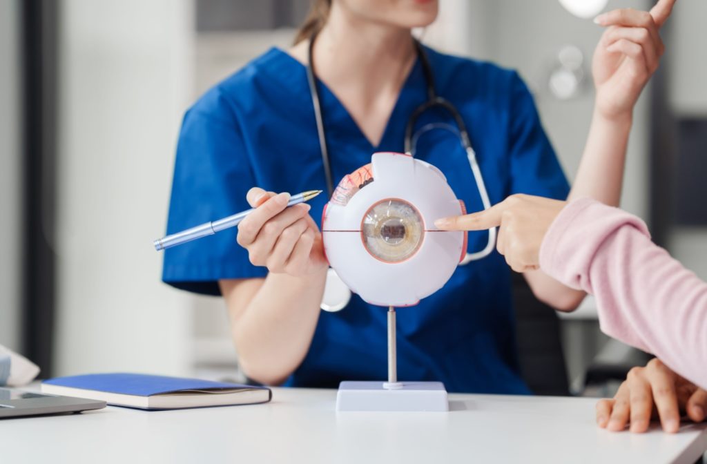 An eye care professional helping a patient by explaining the hereditary components of glaucoma.